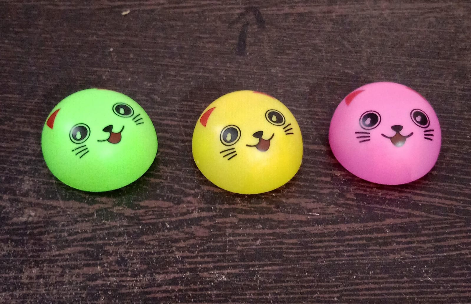 Smiley face toy with pull back action Smiley face toy with pull back action